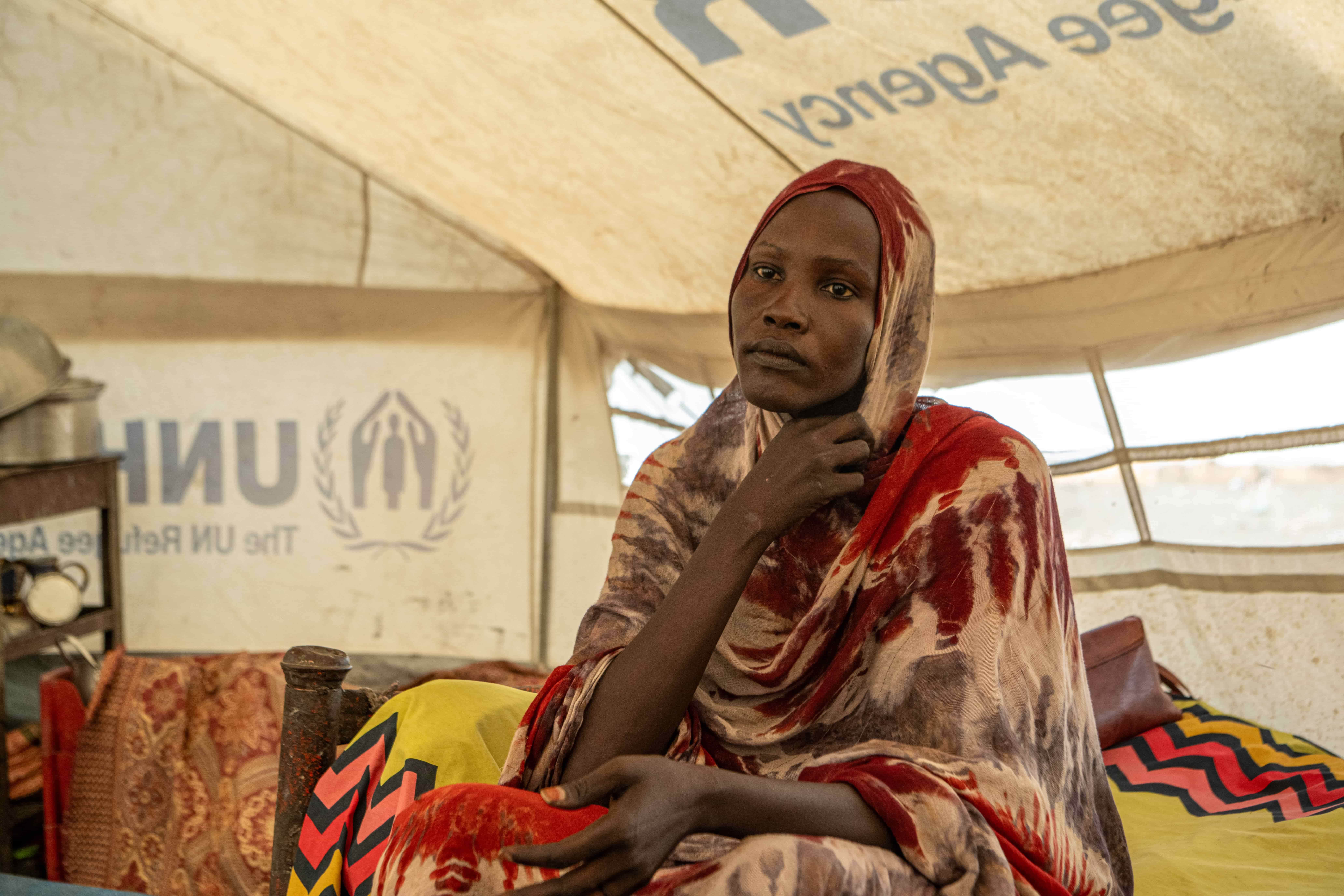 South Sudanese refugee Nyapuot sits in her UNHCR family tent at the Alagaya refugee camp, Al Jabalain, White Nile State. 