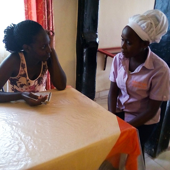 Mercy (right) meets the career counsellor at the vocational training centre at Kyaka II