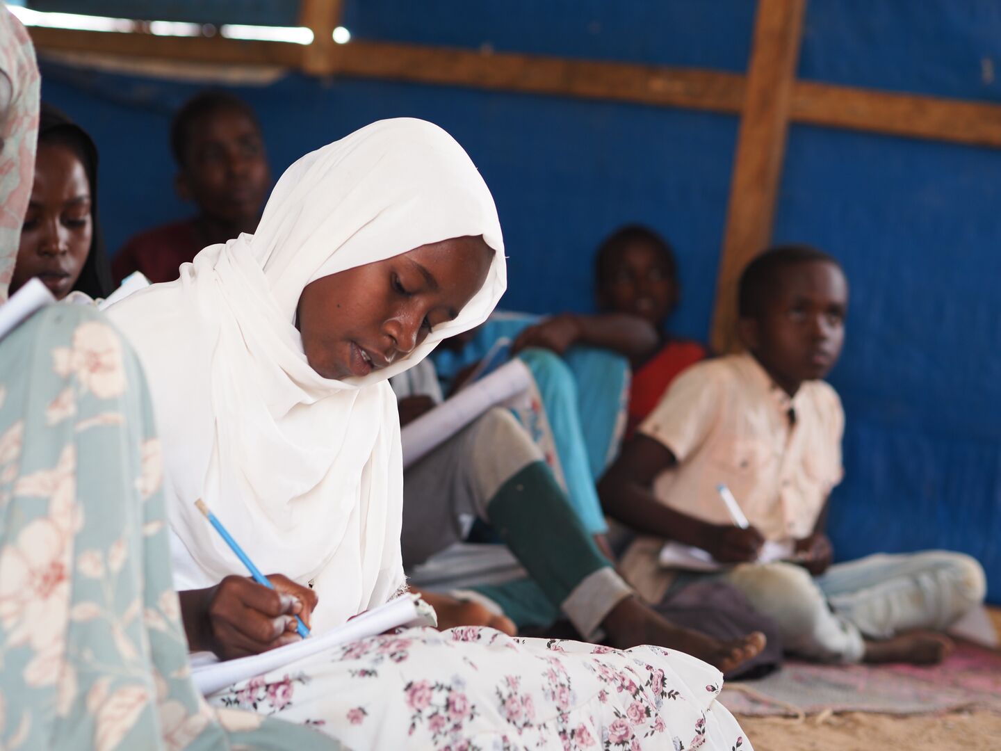 Sudanese refugee girl Isra, dreaming of becoming a doctor, attends her favorite science class in Farchana refugee site