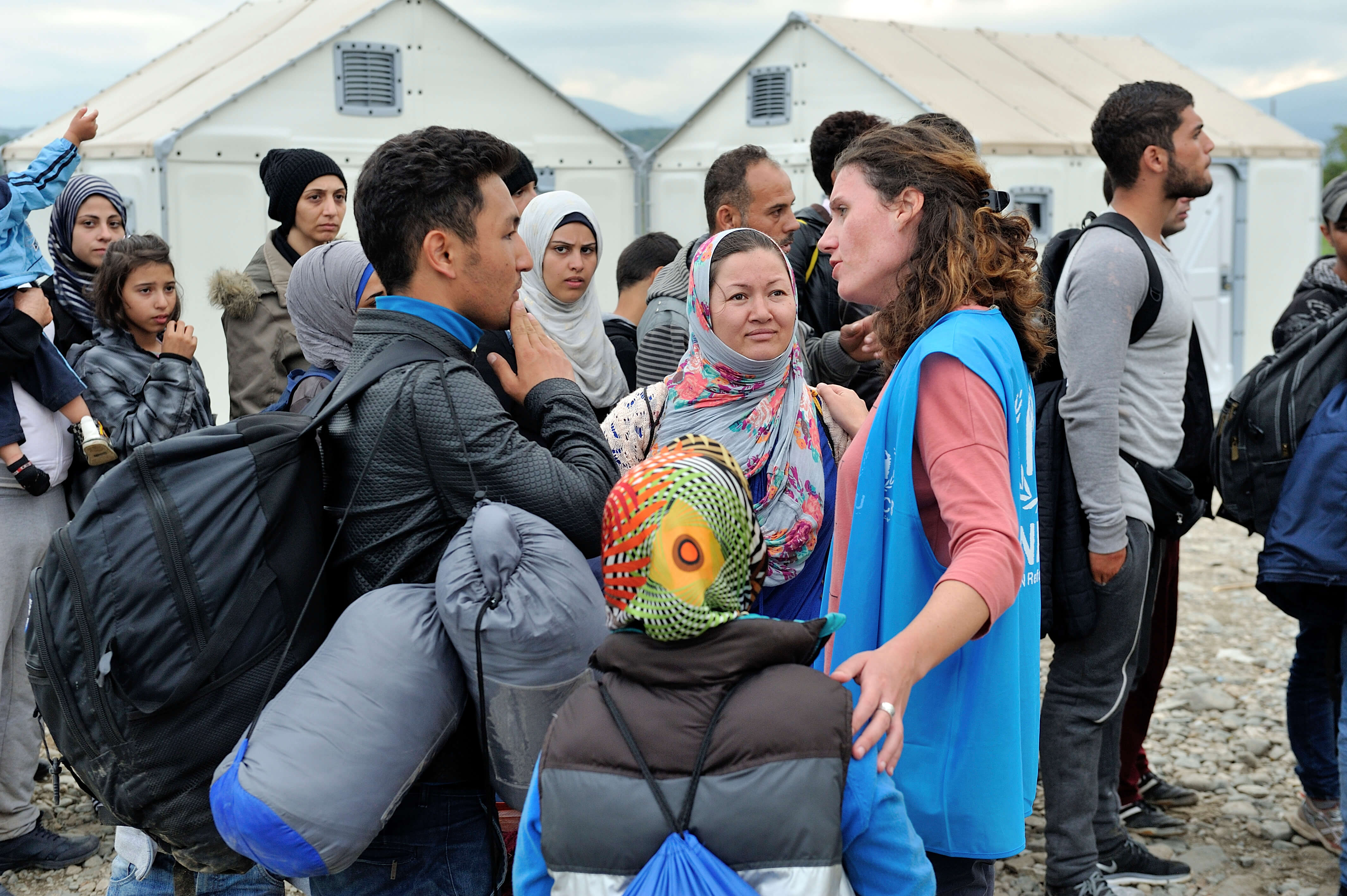 Alexandra Krause, Senior Emergency Coordinator, at work in Former Yugoslav Republic of Macedonia. Talking with Afghan refugees waiting to enter Vinojug Reception Centre near the border with Greece.