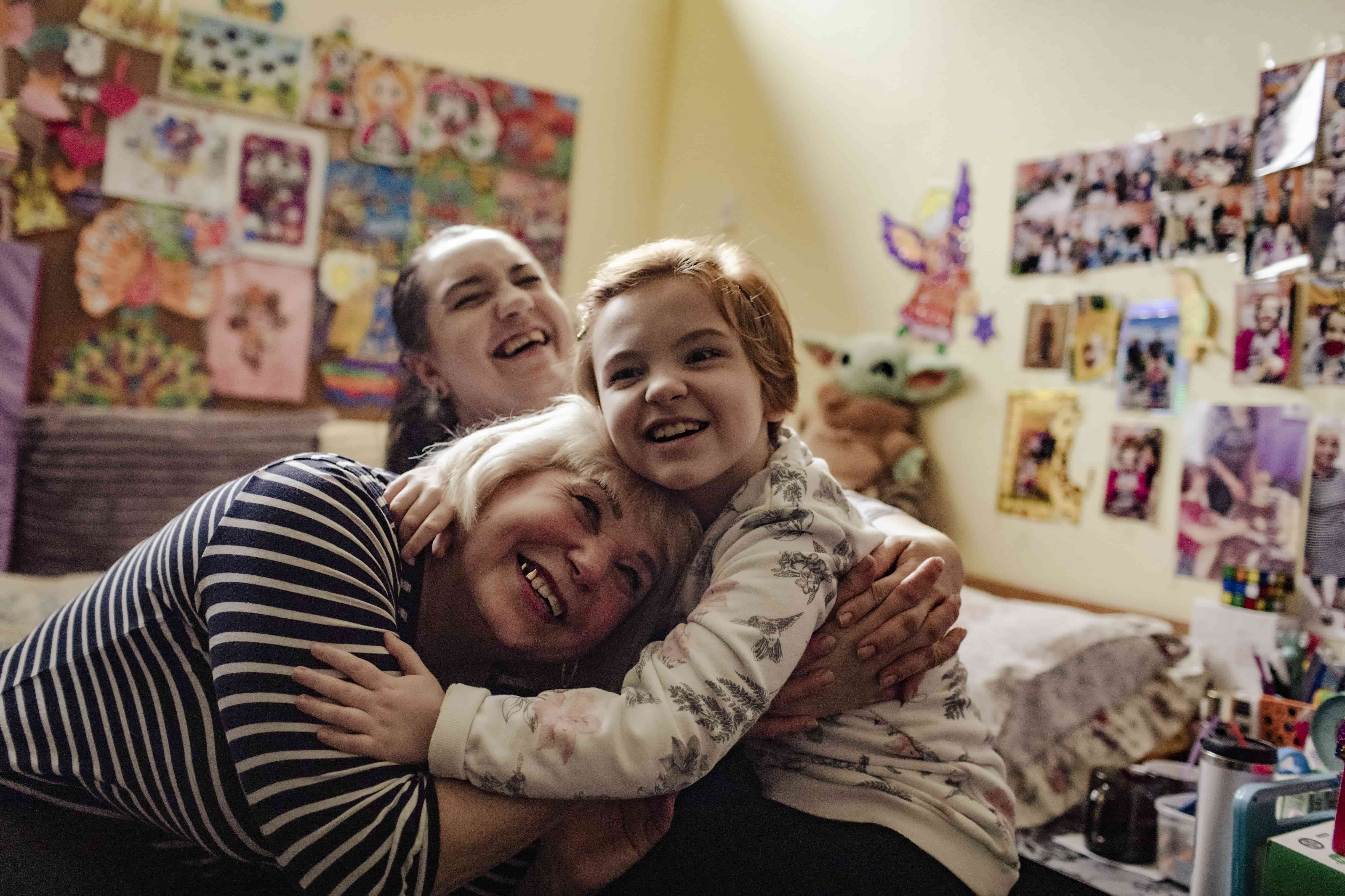 Nadia and her daughters Yuliia and Alisa in their room at the accommodation centre