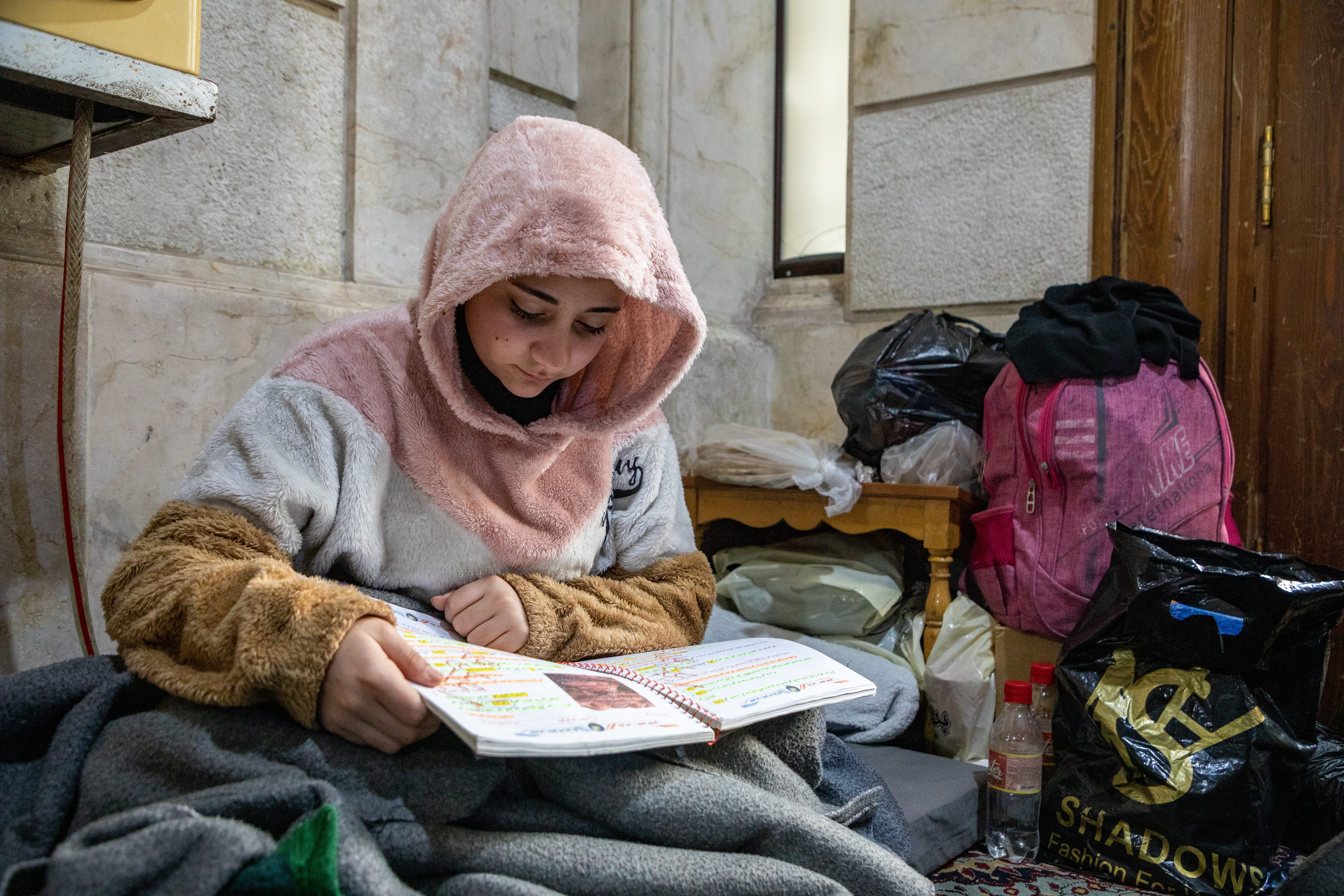 Sarah, 13, continues her studies at a mosque in the Al-Midan district of Aleppo, Syria.
