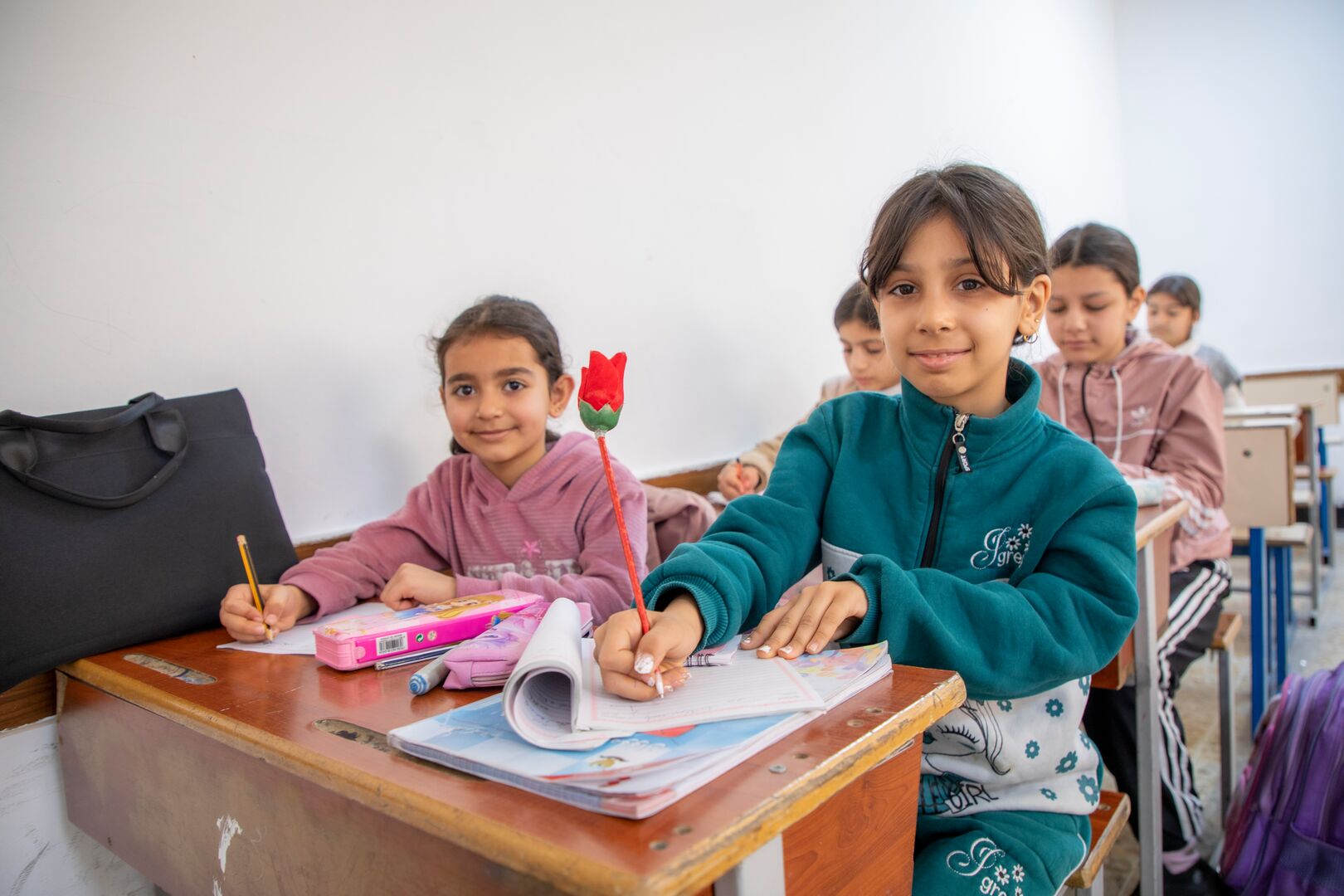 Tojan and Jana, two Syrian refugee students in Erbil, attend UNHCR-supported catch-up classes alongside other refugee and local children.