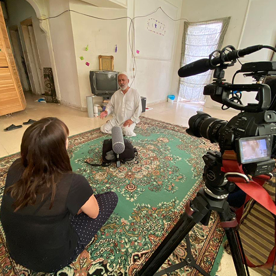 UNHCR worker Lilly Carlisle with refugee families in Jordan